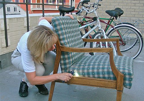 picture of a person inspecting a used chair