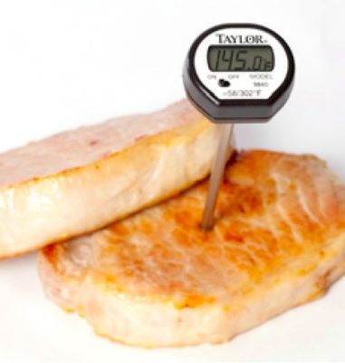 fried fish fillets with thermometer in, showing 145 degrees Fahrenheit
