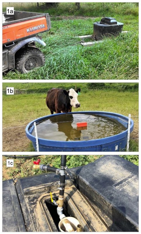 A cattle waterer with the lid off; plastic pipe has been attached to a valve in the trough and leads out of the photo.